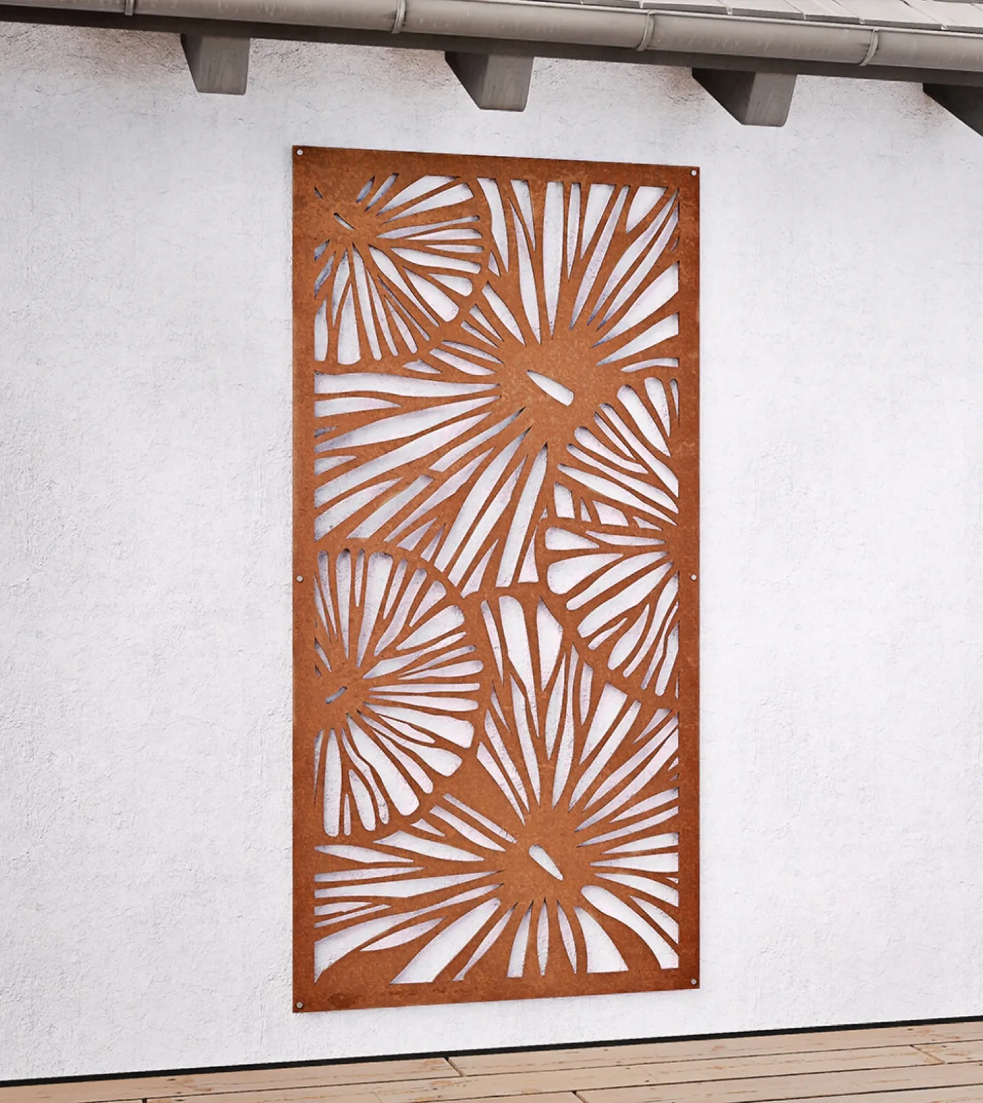 Rust-finish Corten steel decorative screen with a cut botanical pattern against a white wall