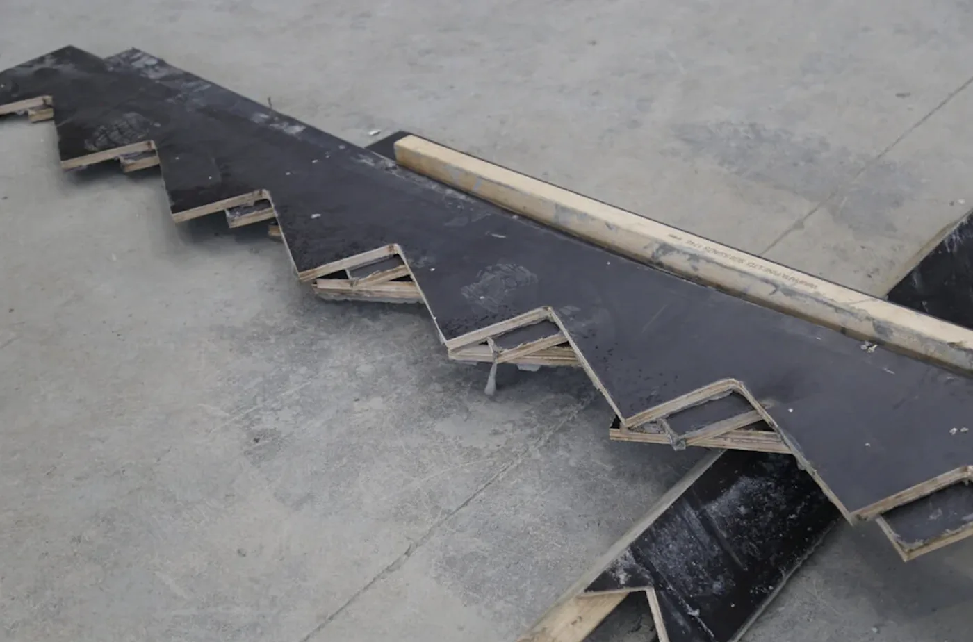 Stacked black formply parts after CNC routing