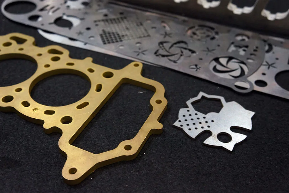 Laser-cut metal components with holes, slots and mounting features
